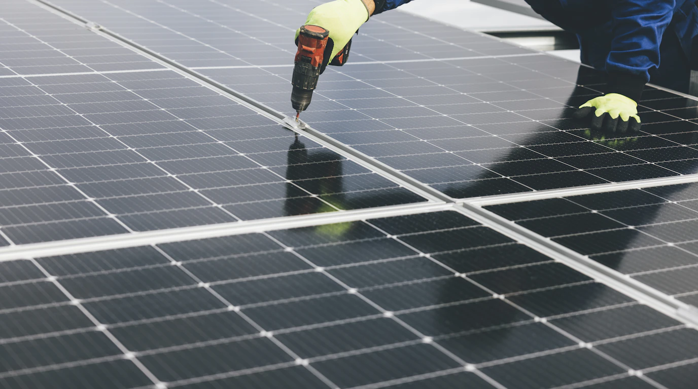 A person working on a solar panel